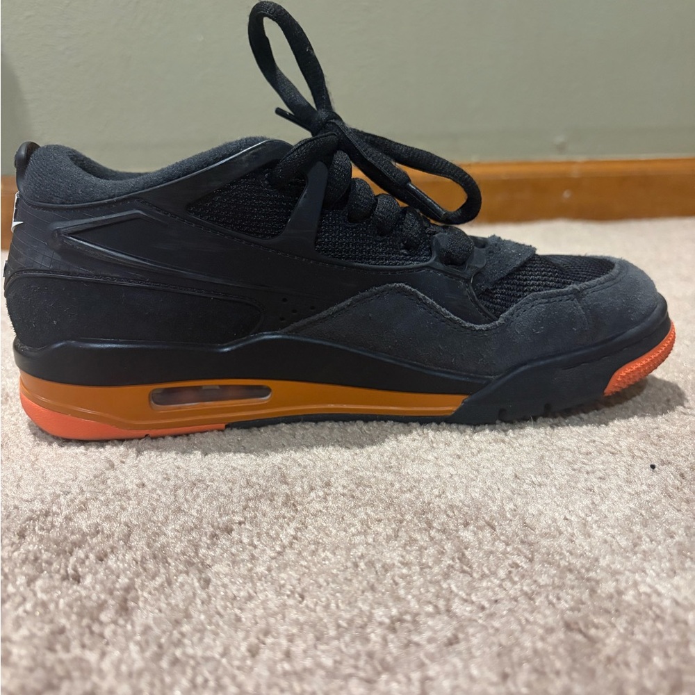 Nike Black Sneaker with Orange Midsole and Red Toe Accent